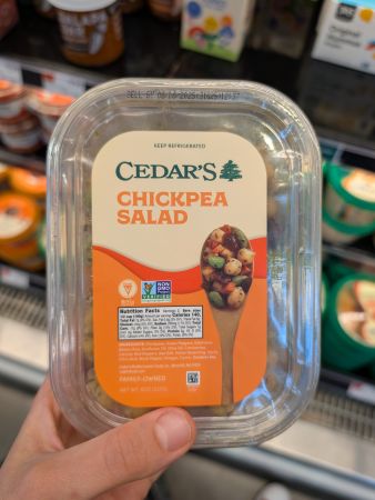 container of Cedar's chickpea salad showing same ingredients as Aldi's