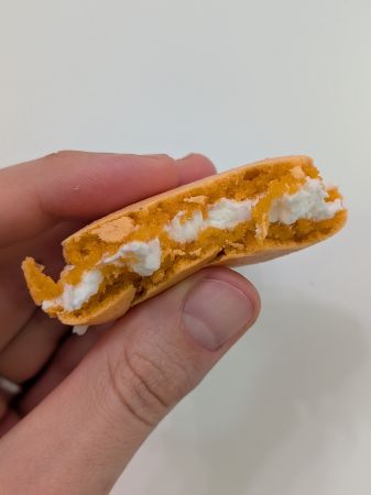 inside of full orange creamsicle vegan macaron