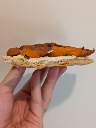 cross section of savory pie showing flaky crust layers