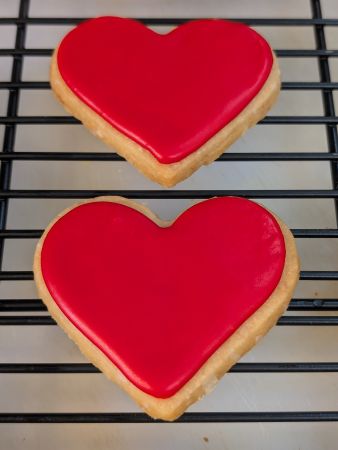 heart cookies with a solid covering of vegan royal icing