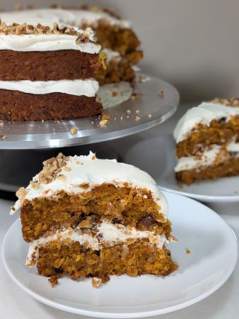 slices of naked vegan carrot cake in front of remainder