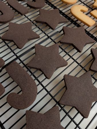 chocolate vegan sugar cookies in star and candy cane shapes
