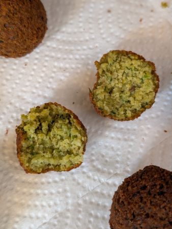 cross section of falafel made with alkalized water-soaked beans, left; pure water-soaked, right